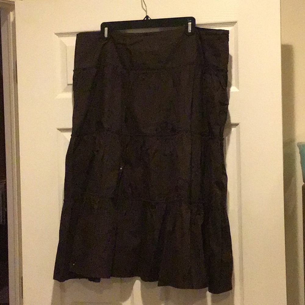 Tiered brown skirt with sequins and embroidery.